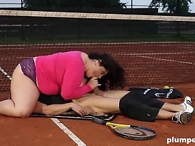 A voluptuous dominatrix with ample bosom instructs tennis on the outdoors, incorporating a face-sitting exercise