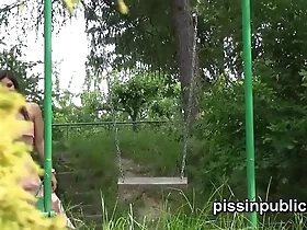 View hot women urinating in a park swing for fetishists